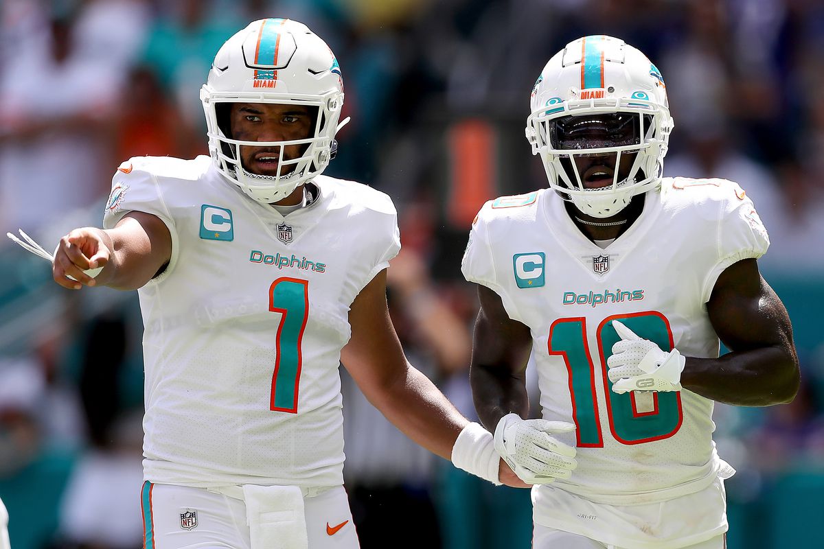 MIAMI GARDENS, FLORIDA - SEPTEMBER 25: Tua Tagovailoa #1 and Tyreek Hill #10 of the Miami Dolphins in action during the first half of the game against the Buffalo Bills at Hard Rock Stadium on September 25, 2022 in Miami Gardens, Florida.