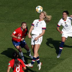 United States' Lindsey Horan, center, heads the ball during the Women's World Cup Group F soccer match between the United States and Chile at the Parc des Princes in Paris, Sunday, June 16, 2019. (AP Photo/Thibault Camus)