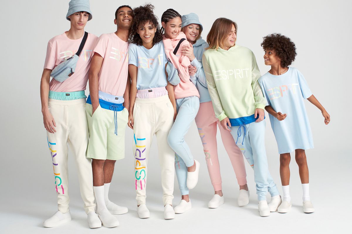 Seven models wearing Espirit by Opening Ceremony logo shirts and sweatpants