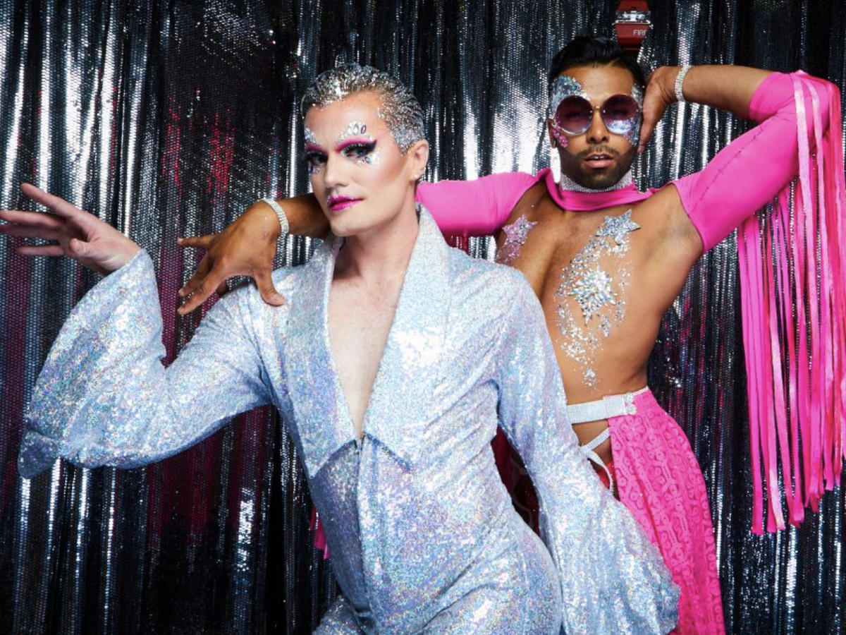 Two people in silver and pink costumes at nightclub House of Yes.