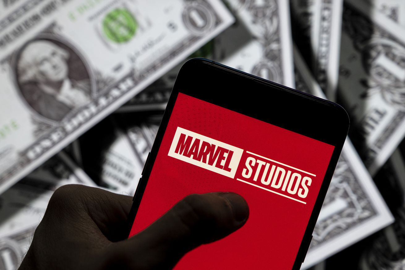 In this photo illustration, a Marvel Studios logo seen...