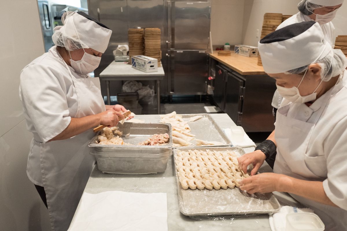 Staff members make homemade dumplings at Din Tai Fung, an iconic Chinese cuisine Dim Sum restaurant in the Silicon Valley, Santa Clara, California, September, 2018. 