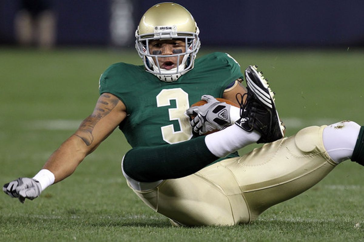NEW YORK - NOVEMBER 20:  Michael Floyd #3 of the Notre Dame Fighting Irish loses his footing against the Army Black Knights at Yankee Stadium on November 20 2010 in the Bronx borough of New York City.  (Photo by Nick Laham/Getty Images)