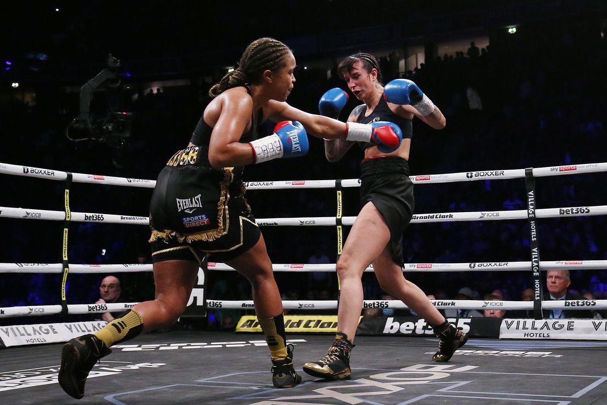 Natasha Jonas (left) punches Christian Namus during their contest for the vacant WBO Female World Super-Welterweight Championship at AO Arena on February 19, 2022 in Manchester, England.