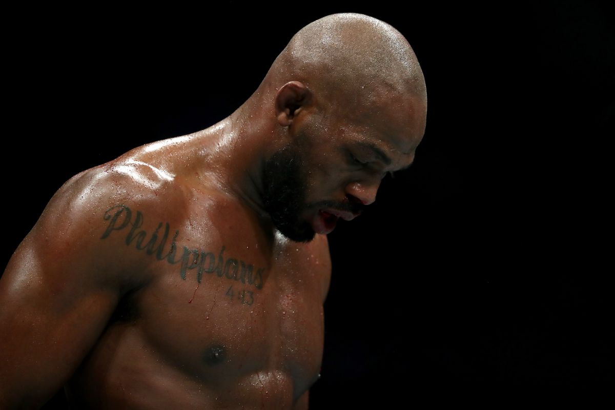Jon Jones walks to his corner in between rounds against Dominick Reyes in their UFC Light Heavyweight Championship bout during UFC 247 at Toyota Center on February 08, 2020 in Houston, Texas.