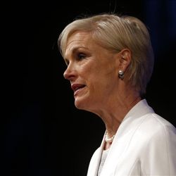 Cecilia Boone, chair of the board of Planned Parenthood, introduces President Barack Obama before he speaks at the 2013 Planned Parenthood National Conference in Washington, Friday, April 26, 2013. (AP Photo/Charles Dharapak)
