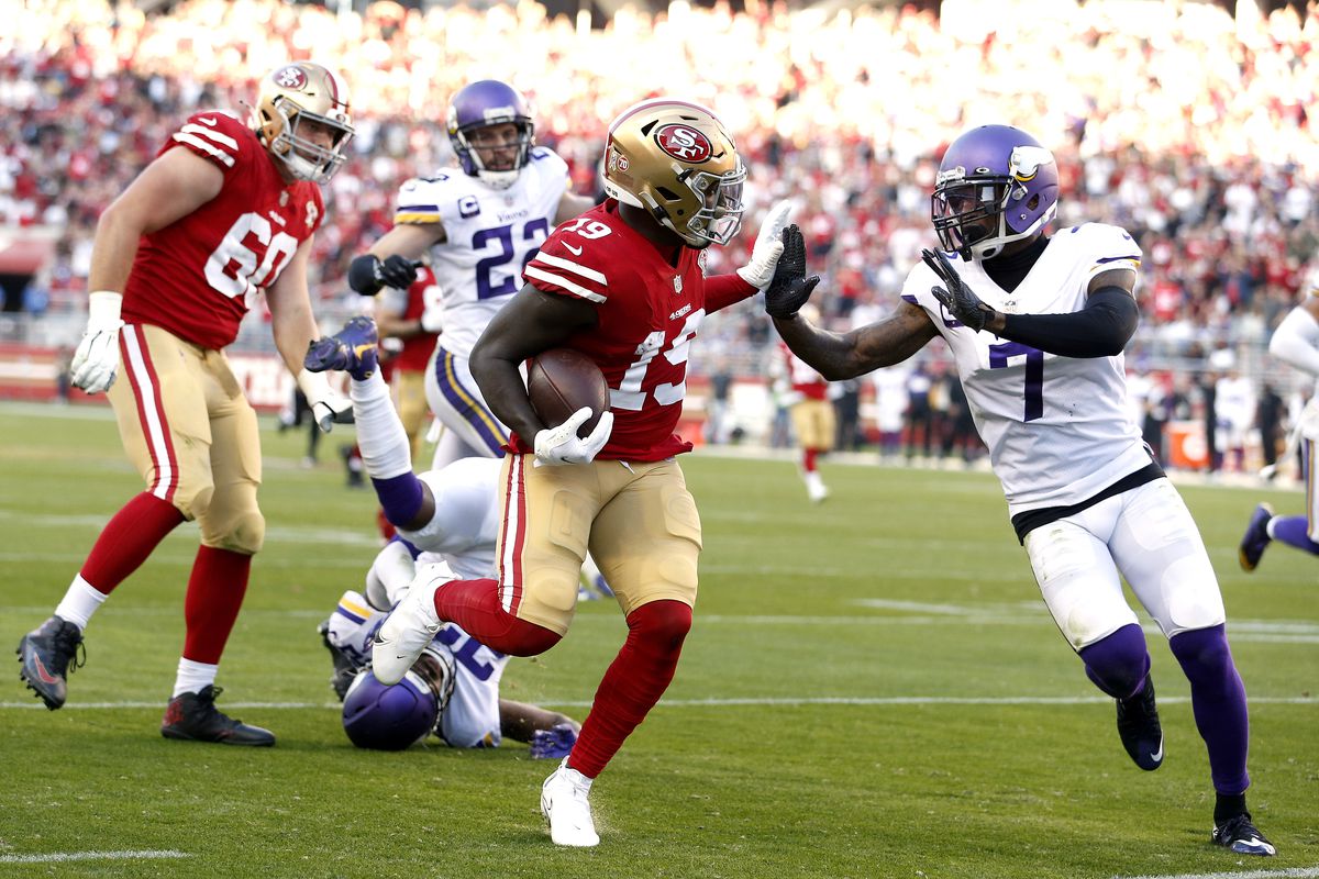 Deebo Samuel #19 of the San Francisco 49ers runs with the ball against Patrick Peterson #7 of the Minnesota Vikings in the third quarter at Levi’s Stadium on November 28, 2021 in Santa Clara, California.