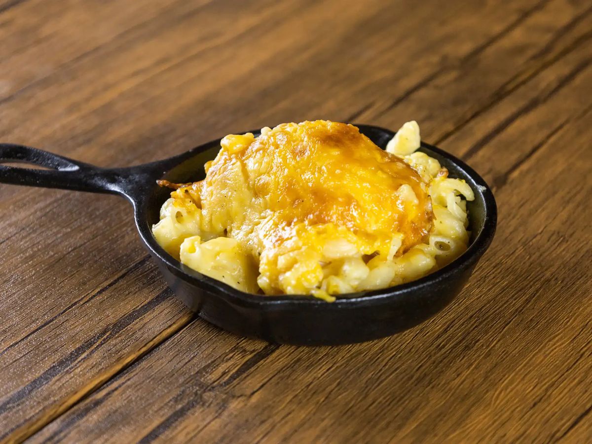 Skillet mac and cheese on a wooden table