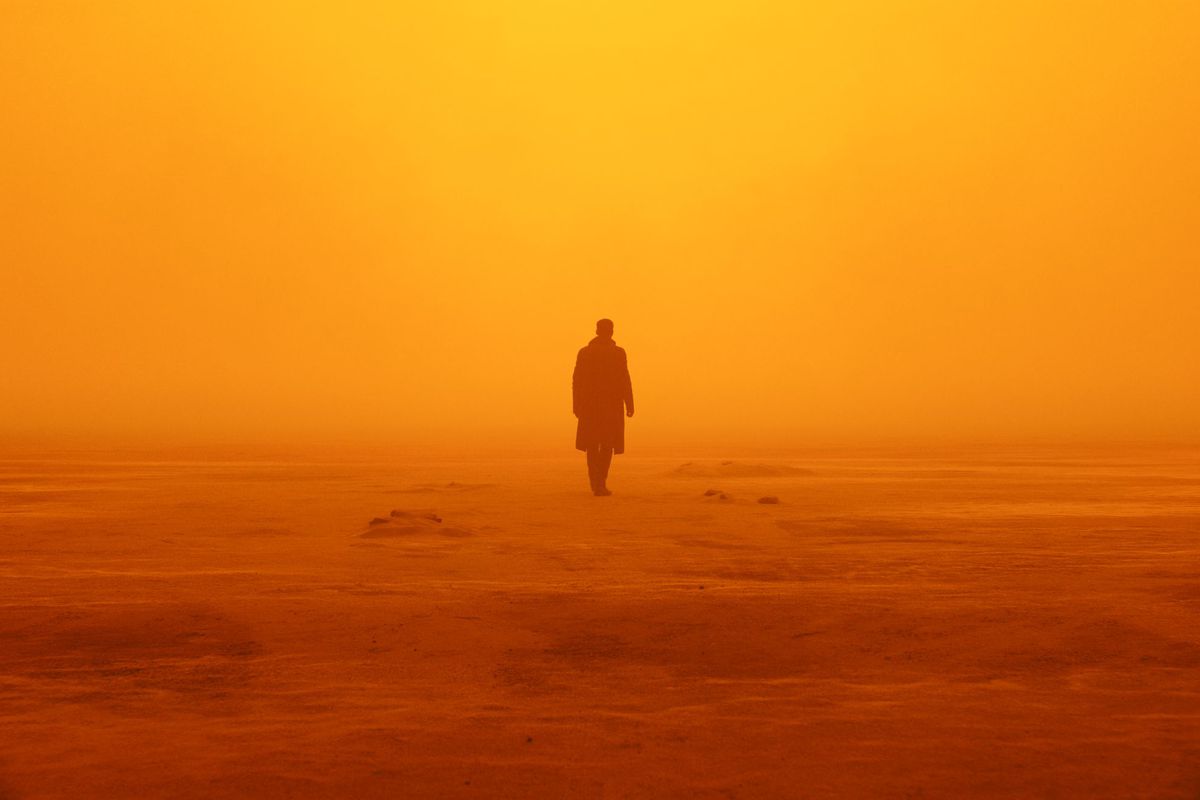 a wide shot of Officer K wandering through a foggy desert in Blade Runner 2049