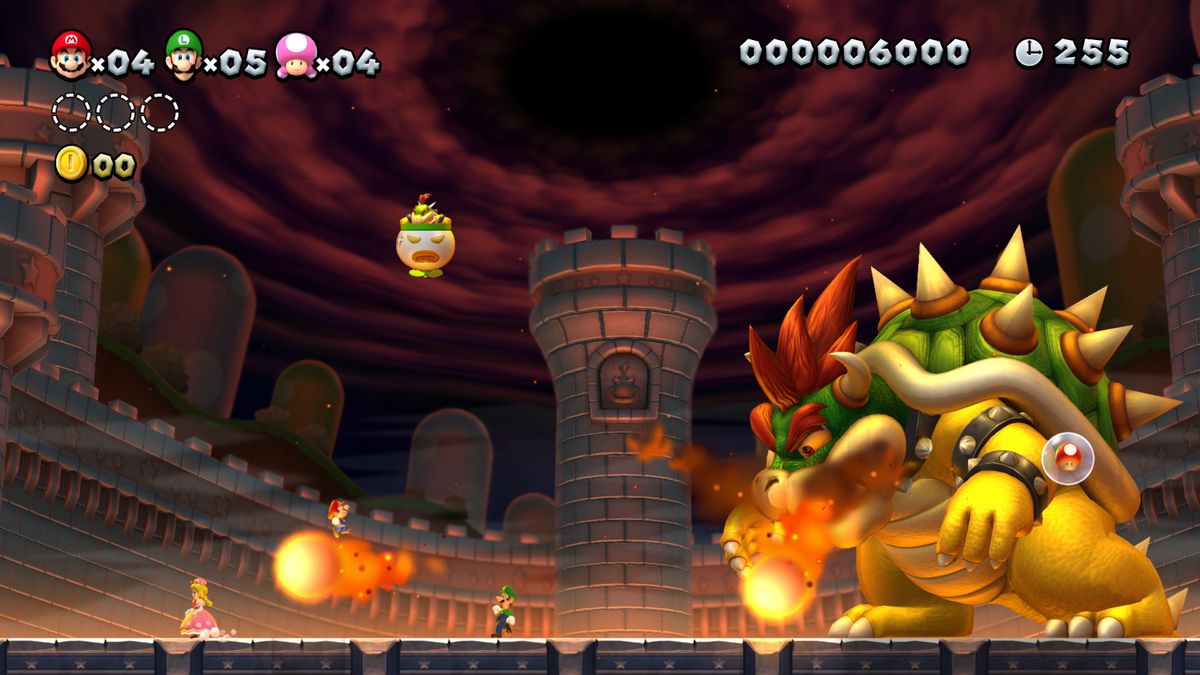 New Super Mario Bros. U Deluxe - Mario, Luigi, and Toadette in boss fight with Bowser