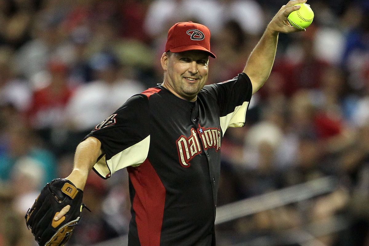 PHOENIX, AZ - JULY 10:  Former MLB player Mark Grace throws the ball during the 2011 Taco Bell All-Star Legends & Celebrity Softball Game at Chase Field on July 10, 2011 in Phoenix, Arizona.  (Photo by Jeff Gross/Getty Images)