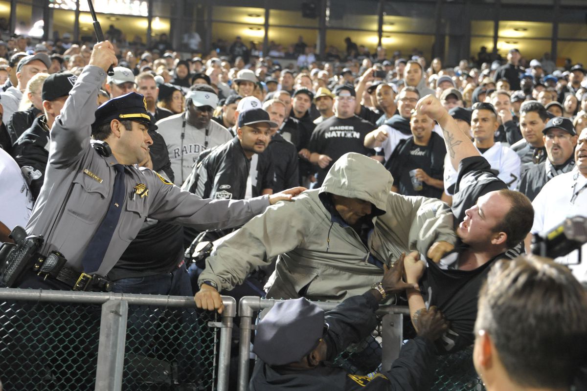 September 10, 2012; Oakland, CA, USA; Fans fight in the stands during the third quarter between the Oakland Raiders and the San Diego Chargers at O.co Coliseum. Mandatory Credit: Kirby Lee/Image of Sport-US PRESSWIRE