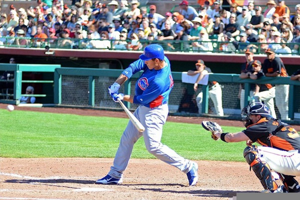 Mar 13, 2012; Scottsdale, AZ, USA; Chicago Cubs first baseman Anthony Rizzo (44) hits a solo home run during the seventh inning against the San Francisco Giants at Scottsdale Stadium.  Mandatory Credit: Jake Roth-US PRESSWIRE