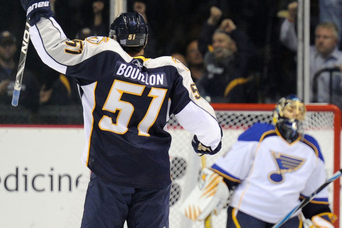 NASHVILLE TN - OCTOBER 14:  Defenseman Francis Bouillon #51 of the Nashville Predators celebrates a goal scored against  the St. Louis Blues on October 14 2010 in Nashville Tennessee.  (Photo by Frederick Breedon/Getty Images)