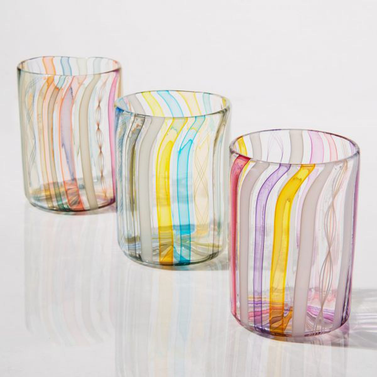 Three cups with colorful stripes. 