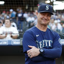 Manager Scott Servais #9 of the Seattle Mariners looks on before the game against the Oakland Athletics