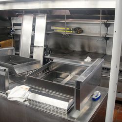 Some of the old stoves are in place, framed by the new toys for Chef Abrams