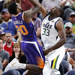 Utah Jazz forward Ekpe Udoh  blocks a shot by Phoenix Suns guard Troy Daniels during NBA basketball in Salt Lake City on Friday, Oct. 6, 2017.