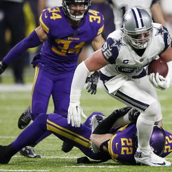 Dallas Cowboys tight end Jason Witten (82) is tackled by Minnesota Vikings free safety Harrison Smith (22) after making a reception during the second half of an NFL football game Thursday, Dec. 1, 2016, in Minneapolis. 