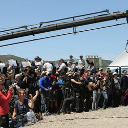 Members of the media cover the 150th anniversary celebration of the completion of the transcontinental railroad at the Golden Spike National Historical Park at Promontory Summit on Friday, May 10, 2019.