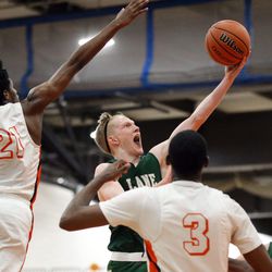 Lane Tech’s Michael Molloy (1) drives to the basket against Whitney Young during their Class 4A Sectional loss, 58-49 in Chicago Friday, March 1, 2019. | Kevin Tanaka/For the Sun Times