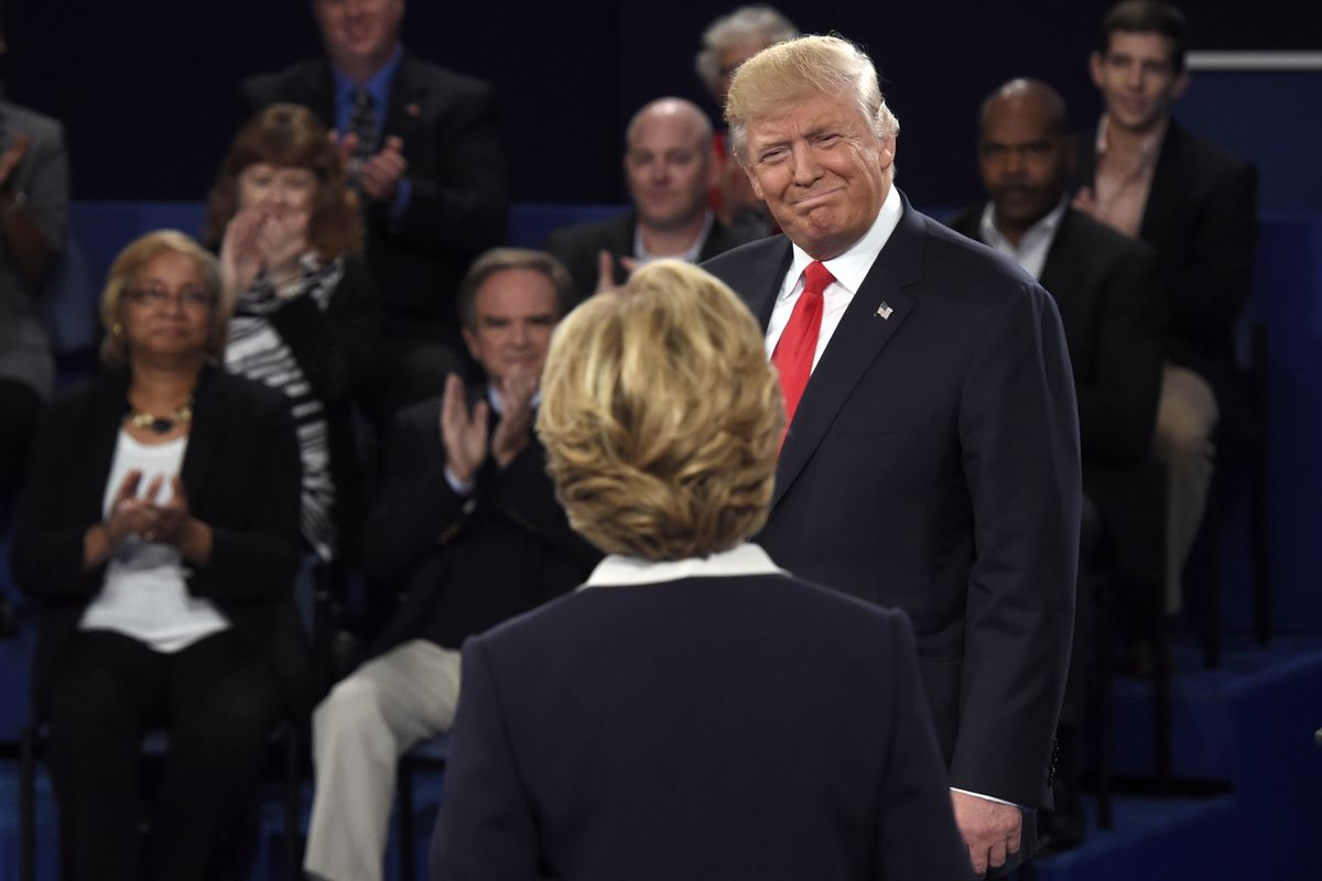 Republican presidential nominee Donald Trump, right, greets Democratic presidential nominee Hillary Clinton before the second presidential debate at Washington University in St. Louis, Sunday, Oct. 9, 2016.