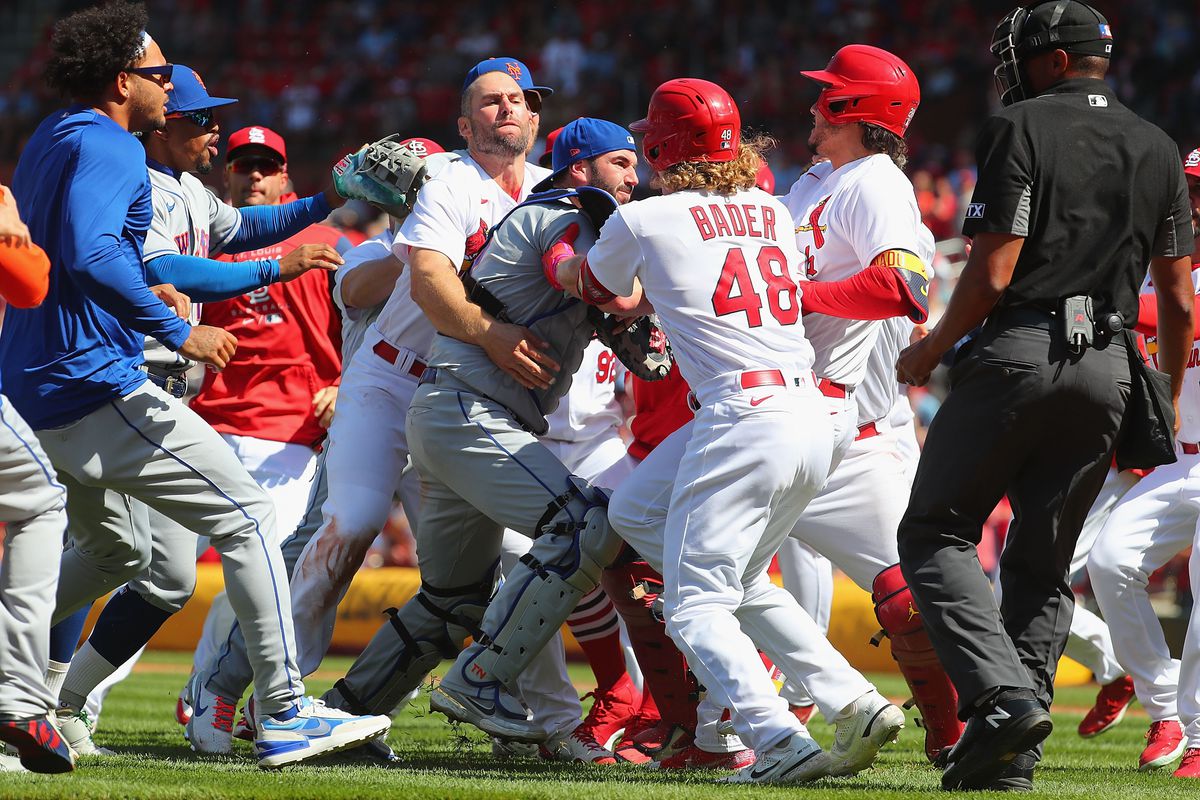 Paul Goldschmidt #46 of the St. Louis Cardinals attempts to restrain Tomas Nido #3 of the New York Mets after the benches cleared in the eighth
