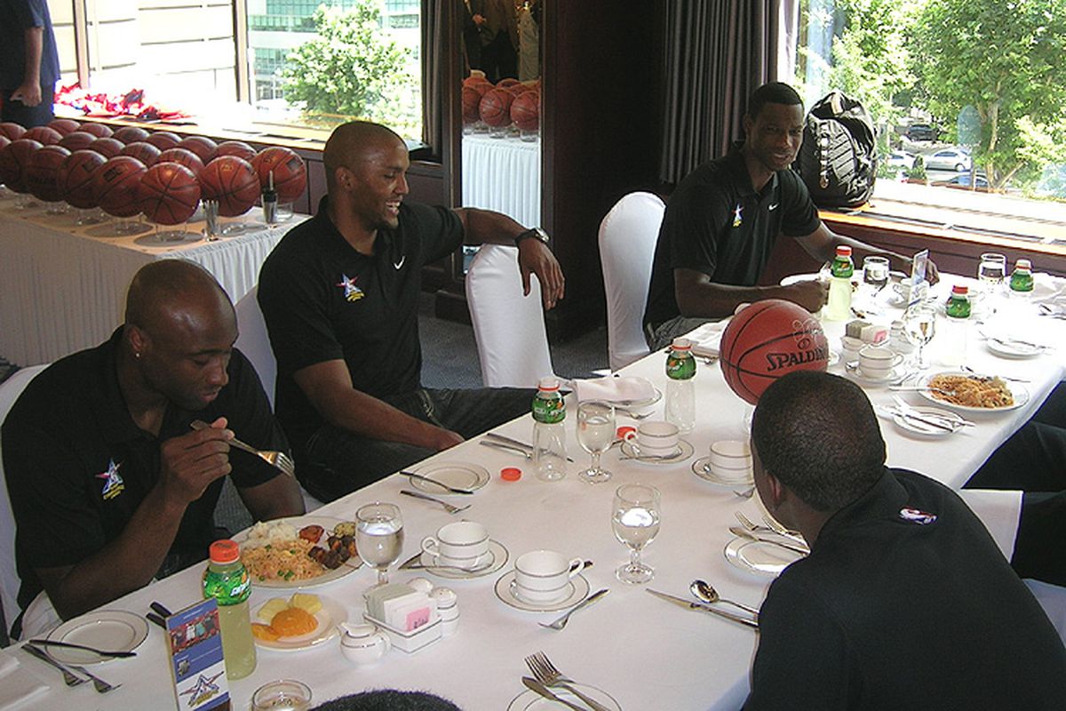 D-League players chowing down before the game (via <a href="http://www.nba.com/media/dleague/asia_090903_4.jpg">www.nba.com</a>)