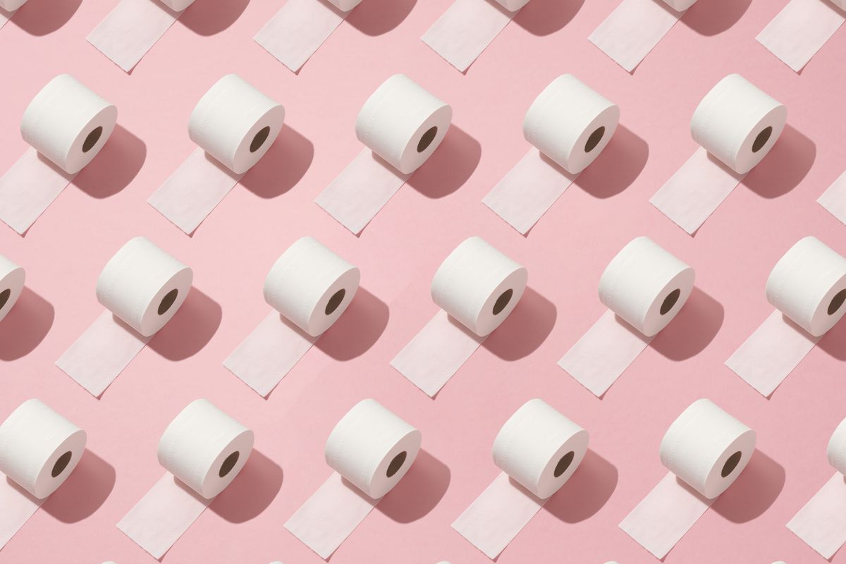 Rolls of toilet paper on a pink background