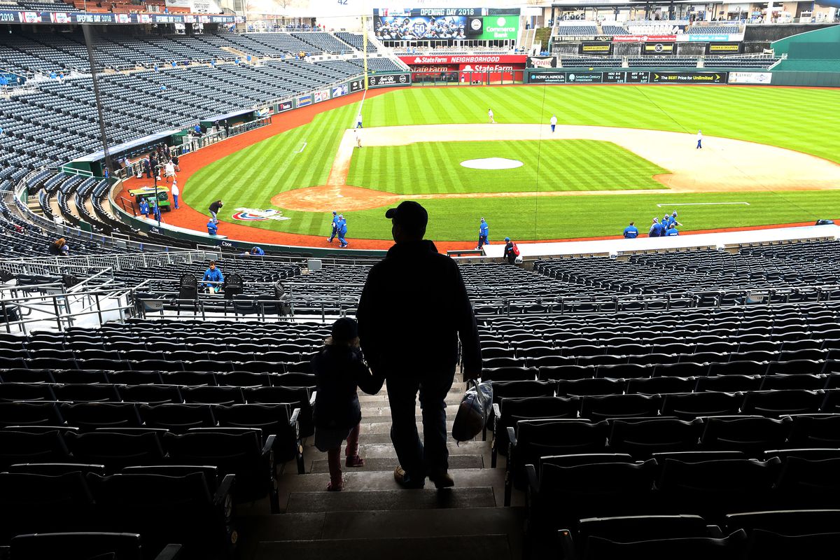 A father and his daughter walk through the stands toward the field as they arrive early on Opening Day ahead of the game between the Chicago White Sox and the Kansas City Royals at Kauffman Stadium on March 29, 2018 in Kansas City, Missouri.