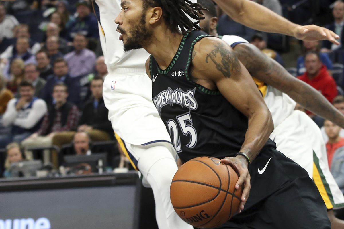 Minnesota Timberwolves' Derrick Rose drives around Utah Jazz's Rudy Gobert during the second half of an NBA basketball game Wednesday, Oct. 31, 2018, in Minneapolis. Rose led the Timberwolves with 50 points, a career high, in the Timberwolves' 128-125 win