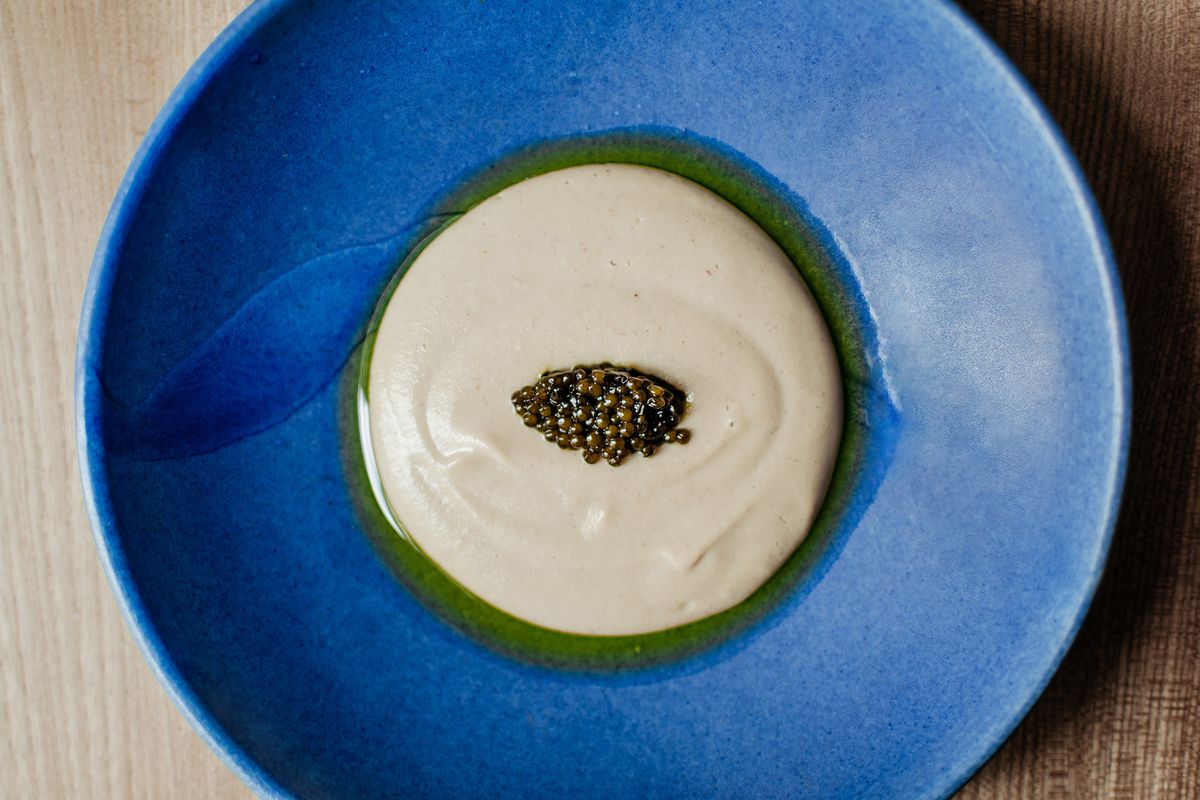 London’s best restaurants: Tigernut mousse with caviar on a blue bespoke plate at Michelin-starred Ikoyi restaurant in London