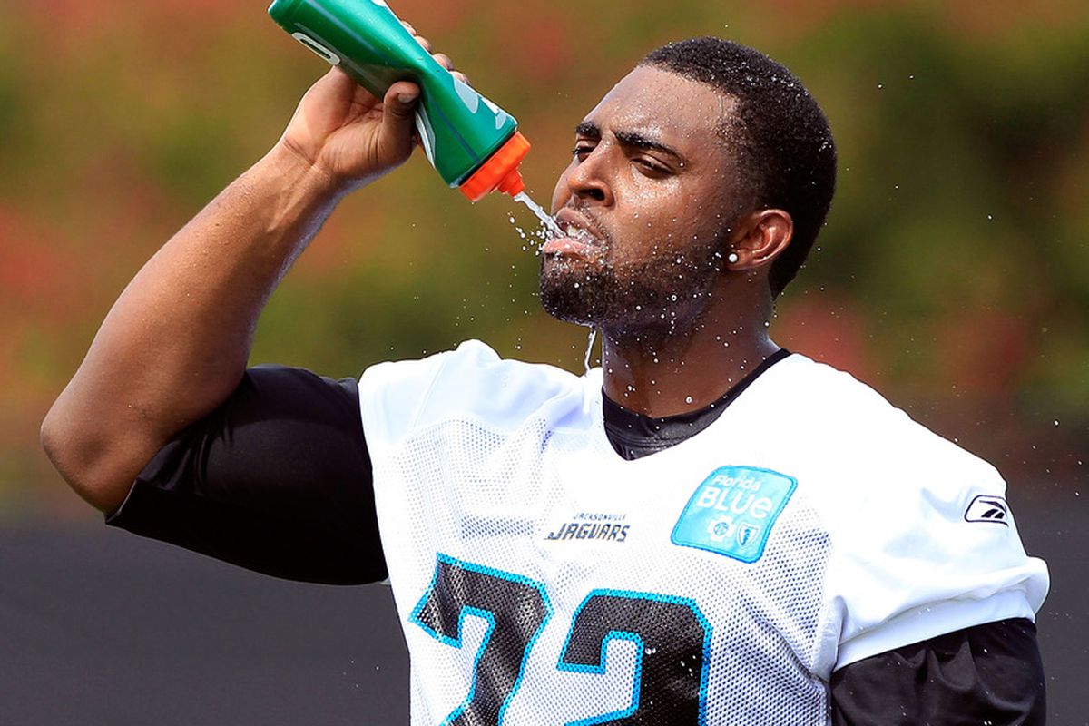 Kevin Haslam #72 of the Jacksonville Jaguars drinks water during training camp