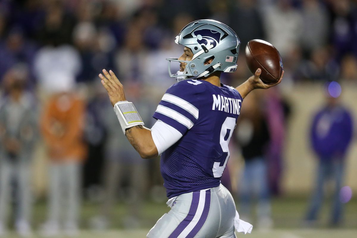 Kansas State Wildcats quarterback Adrian Martinez (9) drops back to pass during the third quarter against the Texas Longhorns at Bill Snyder Family Football Stadium.