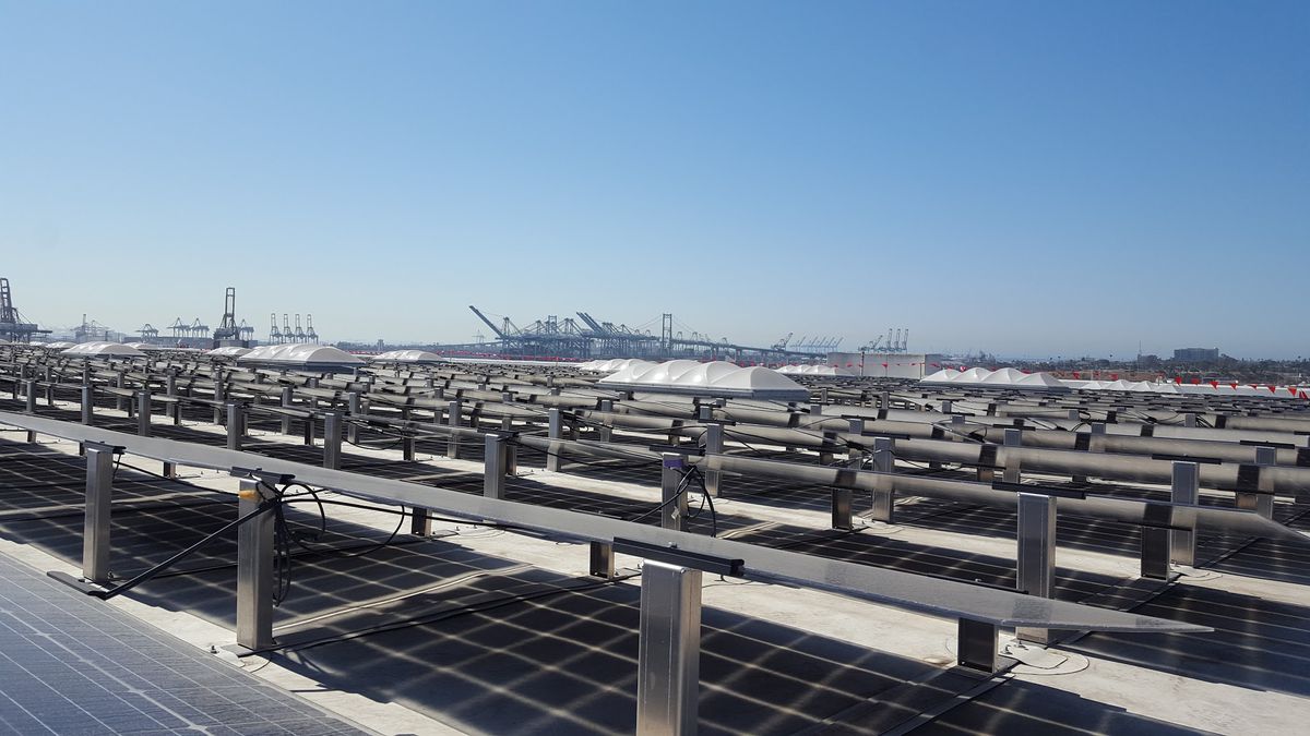 Solar panels with Vincent Thomas bridge in background