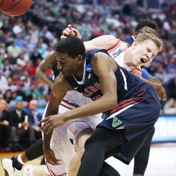 Utah Utes forward Jakob Poeltl (42) loses the ball under pressure from Fresno State Bulldogs guard Paul Watson (3) during the NCAA Tournament in Denver on Thursday, March 17, 2016. Utah won 80-69. 