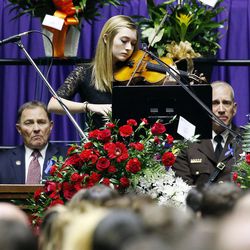 McCall Andersen performs during funeral services for Utah Highway Patrol trooper Eric Ellsworth at the Dee Events Center in Ogden on Wednesday, Nov. 30, 2016.