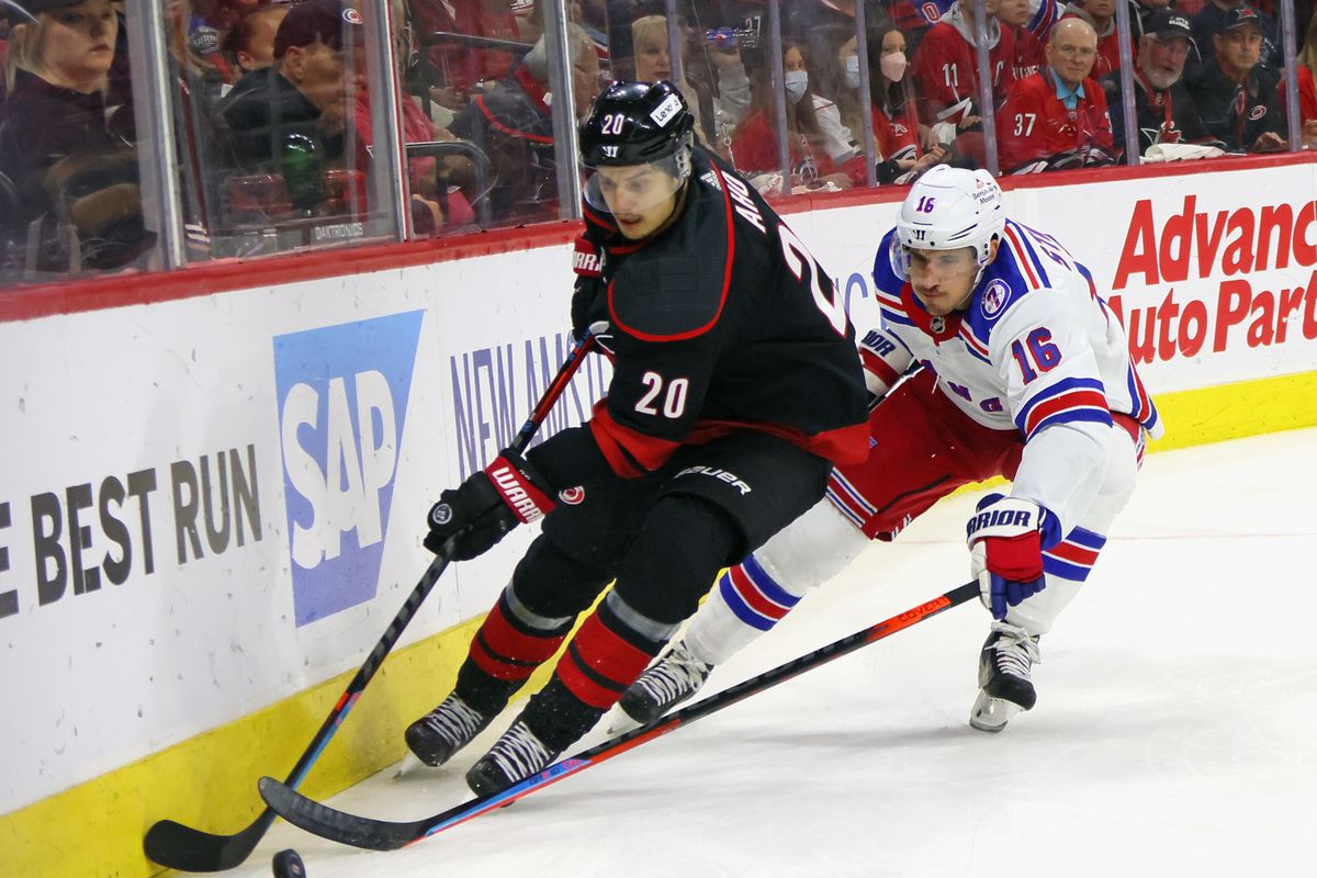 Ryan Strome #16 of the New York Rangers skates against Sebastian Aho #20 of the Carolina Hurricanes in Game Two of the Second Round of the 2022 Stanley Cup Playoffs at PNC Arena on May 20, 2022 in Raleigh, North Carolina. The Hurricanes shutout the Rangers 2-0.