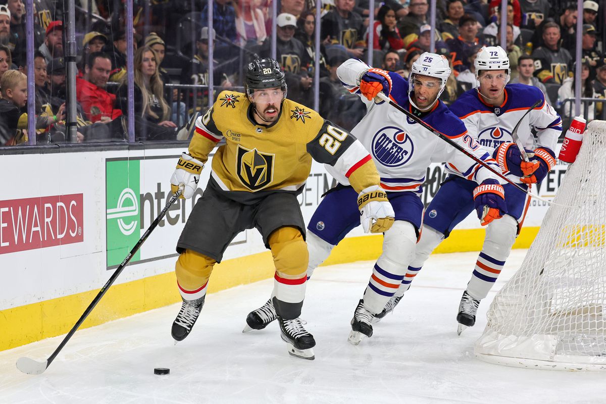 Chandler Stephenson #20 of the Vegas Golden Knights skates with the puck ahead of Darnell Nurse #25 and Nick Bjugstad #72 of the Edmonton Oilers in the second period of their game at T-Mobile Arena on March 28, 2023 in Las Vegas, Nevada.