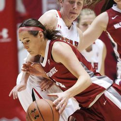 Utah's Rachel Messer works to defend Brandi Thomas as Utah and Washington State play Sunday, Feb. 24, 2013 in the Huntsman Center.
