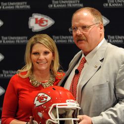 Kansas City, MO, USA; Newly hired Kansas City Chiefs head coach Andy Reid and wife Tammy Reid pose for photos during the press conference at Arrowhead Stadium. 