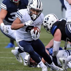 Brigham Young Cougars running back Trey Dye (6) runs with the ball during a spring football scrimmage at LaVell Edwards Stadium in Provo, Saturday, March 26, 2016.