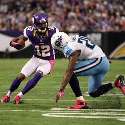 Minnesota Vikings wide receiver Percy Harvin (12) runs for a 10-yard touchdown during the third quarter against the Tennessee Titans at the Metrodome. 