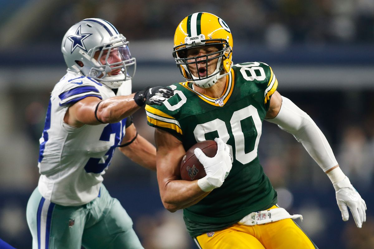 Green Bay Packers tight end Jimmy Graham is tackled by Dallas Cowboys strong safety Jeff Heath in the second quarter at AT&amp;T Stadium.