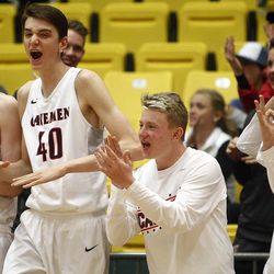 The American Fork bench celebrates after making a three-point basket in the first round of the 5A boys basketball tournament against Fremont at the UCCU Events Center in Orem, Tuesday, March 1, 2016.