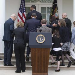President Barack Obama center leaves a news conference in the Rose Garden of the White House, Wednesday, April 17, 2013, in Washington, about measures to reduce gun violence, with Vice President Joe Biden, second from left, former Rep. Gabby Giffords, third from left, and Newtown family members from left, Neil Heslin, father of Jesse Lewis; Jimmy Greene, father of Ana; Nicole Hockley, mother of Dylan; Mark and Jackie Barden, with their children Natalie and James, who lost Daniel; and Jeremy Richman, father of Avielle, behind the Barden's.