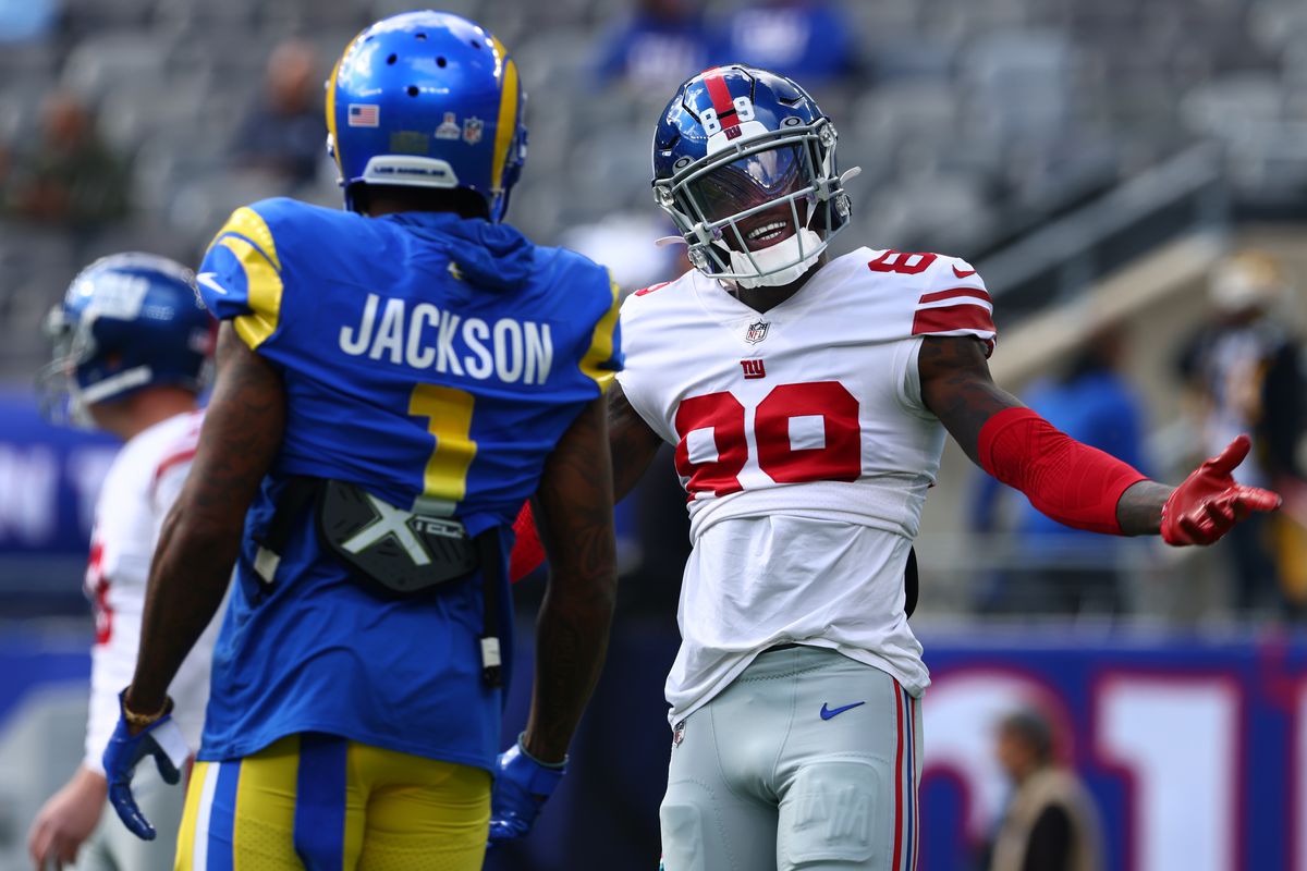 Kadarius Toney #89 of the New York Giants talks with DeSean Jackson #1 of the Los Angeles Rams before a game at MetLife Stadium on October 17, 2021 in East Rutherford, New Jersey.
