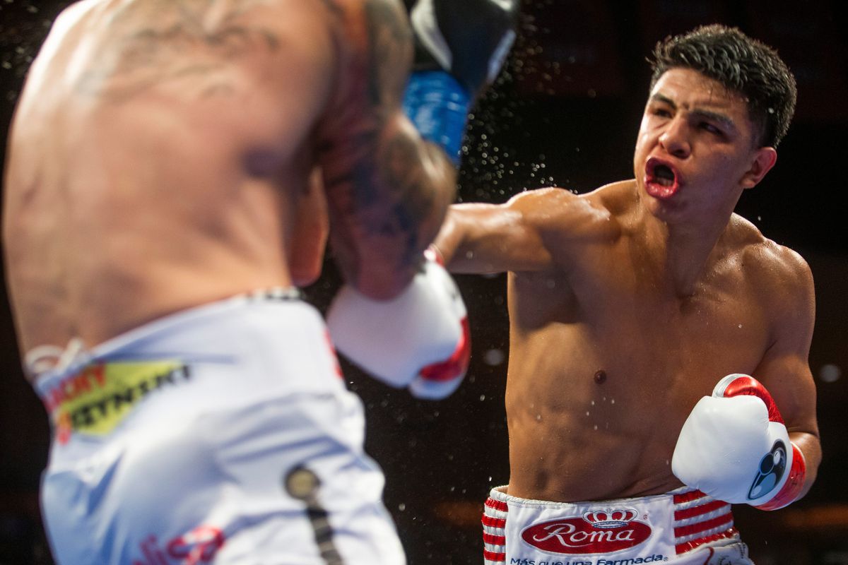 Jaime Munguia, in red corner gloves, fights Kamil Szeremeta. Munguia retained his WBO Intercontinental Middleweight Championship after Szeremeta is unable to answer the 7th round at the Don Haskins Center