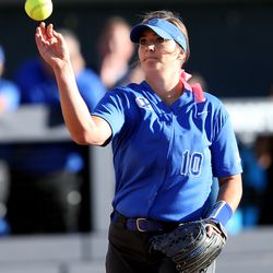 BYU's Arissa Paulsen throws to first base for an out as BYU and Utah play in a softball game at BYU in Provo on Wednesday, May 1, 2019. Utah won 11-2.
