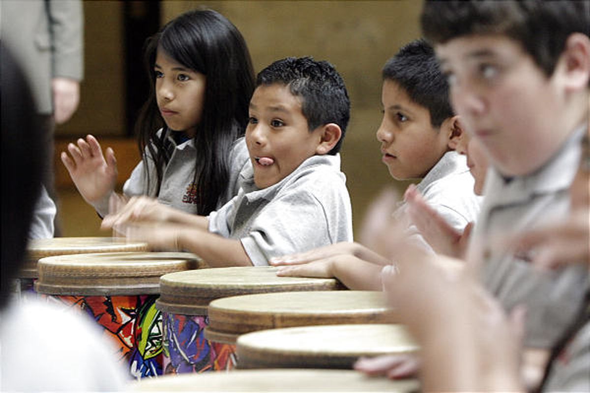 Students from Dixie Sun Elementary School in St. George play tubano drums in the Capitol rotunda Tuesday. The fourth- and fifth-graders also played violins and sang in the House of Representatives. The school participates in the Beverley Taylor Sorenson A